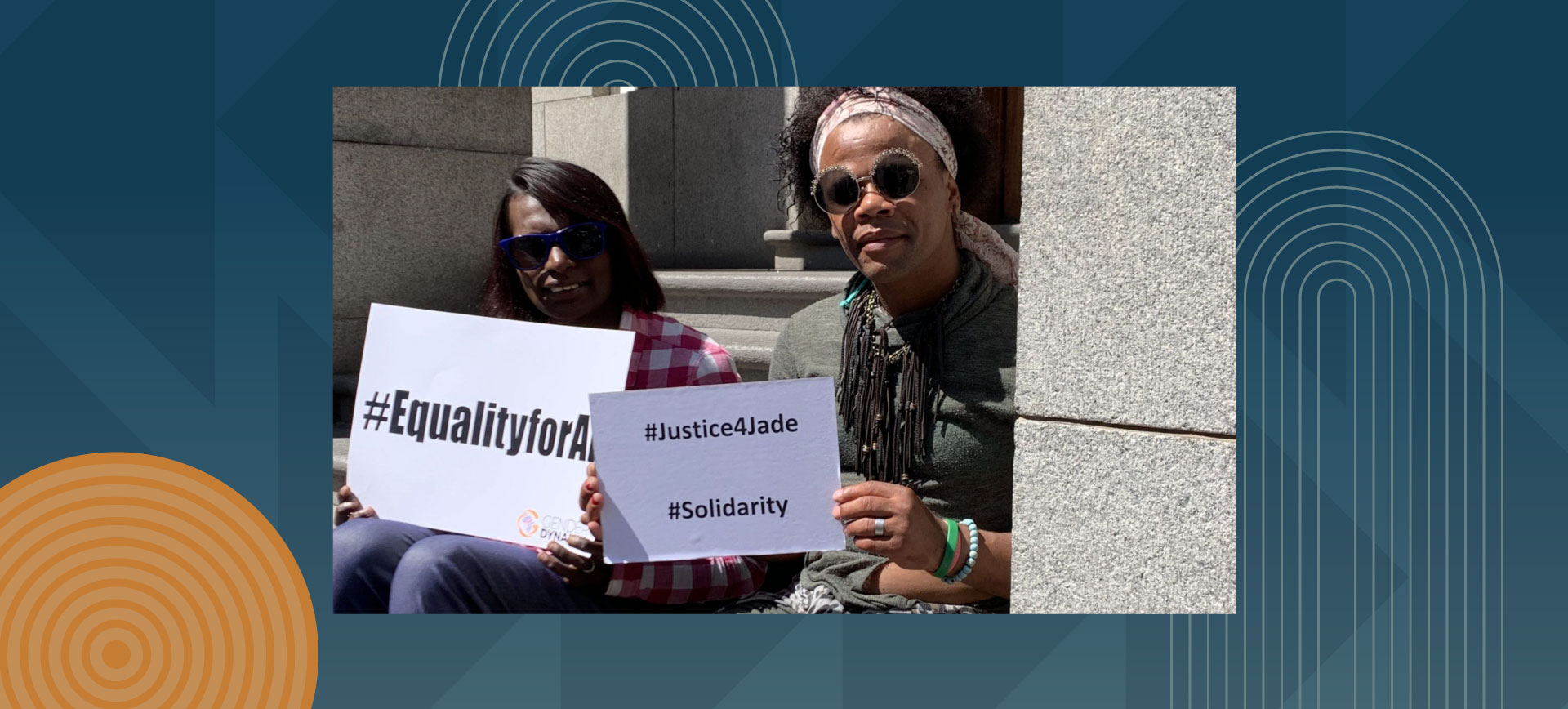 Two women holding protest signs with hashtags EqualityforAll, Justice4Jade, and Solidarity